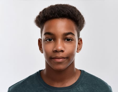 Studio Portrait of African Teenager with Defined High Curled Texture on White Background photo