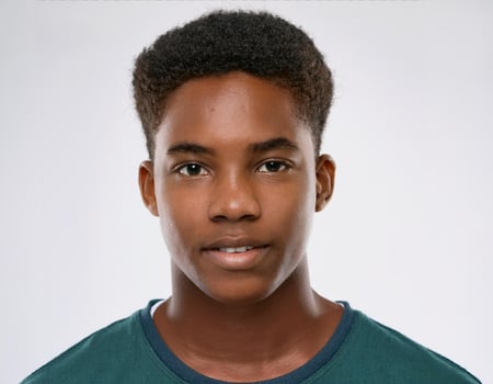 Portrait of African Teenager with Defined Defined Curly Shaggy Hair on White Background photo
