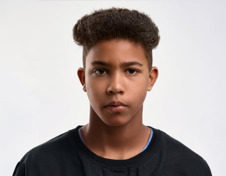 Portrait of African Teenager with Defined Defined Defined Defined Full Natural Curly Braids on White Background photo