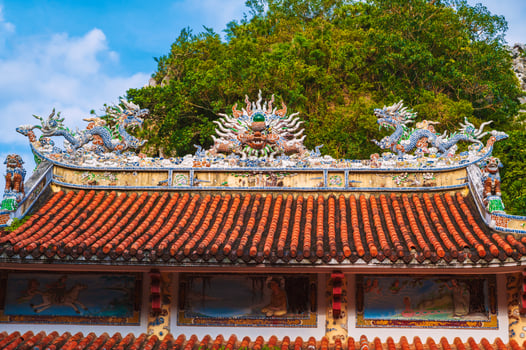 The roof of the Buddhist Temple on the Marble mountains in Da Nang during the day photo