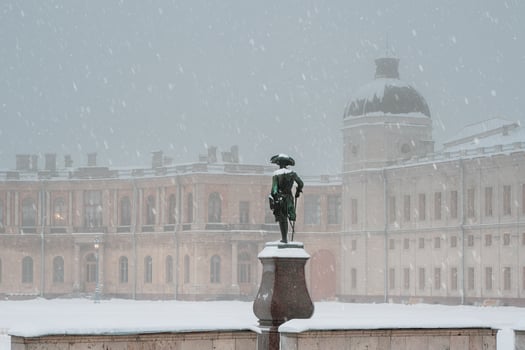 Gatchina, Russia, on 7 January 2022 Winter foggy view of the Great Gatchina Palace and the monument to Paul 1 from the back. photo
