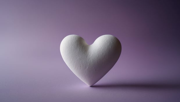 White Heart Decoration on Purple Background. photo