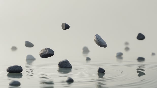 A series of small rocks are floating in a body of water photo