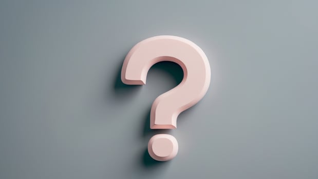 Pastel pink question mark with rounded edges on a soft gray background conveying curiosity and inquiry photo