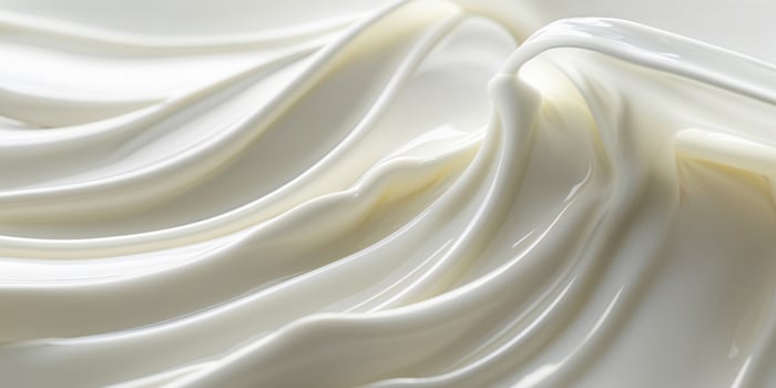 Smooth creamy milk texture in flowing waves photo