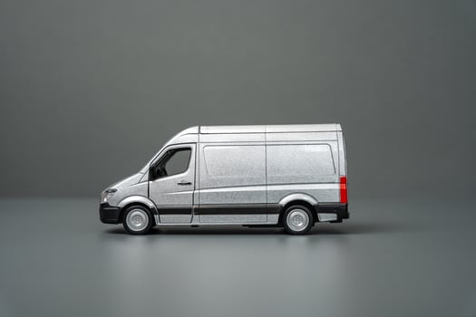 Gray delivery van side view. Copy space. Place for text. Local delivery and transportation of goods. Logistics, supply. Transport industry. photo