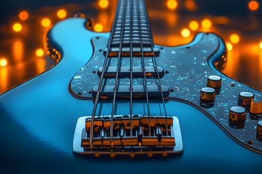 Electric Bass Guitar Close-Up with Warm Bokeh Lighting for Music-Inspired Designs photo