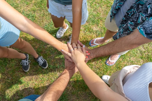 Teamwork, unity concept, group of friends put their hands together. photo