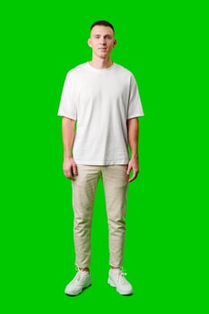Young Man With Short Hair Smiling Against a Bright Green Background photo