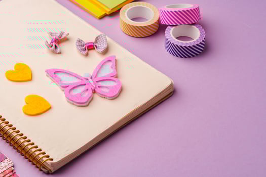 Crafting supplies on a purple background ready for creative projects photo