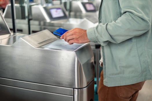 latin Tourist using smartphone to validate electronic ticket at subway station entrance photo