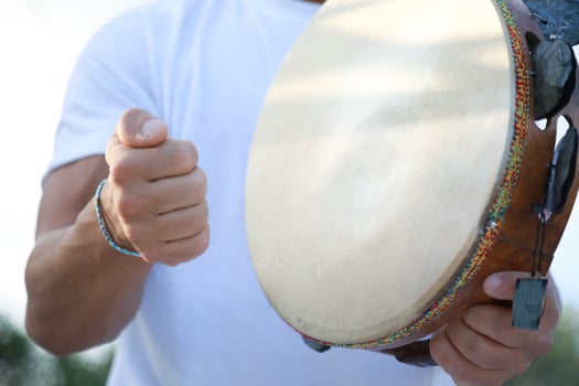 Joyful Tambourine Beats in Rolling Countryside photo