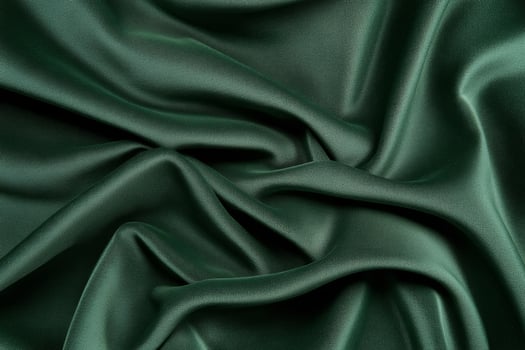 Luxurious Green Satin Fabric with Elegant Soft Folds and Smooth Texture photo