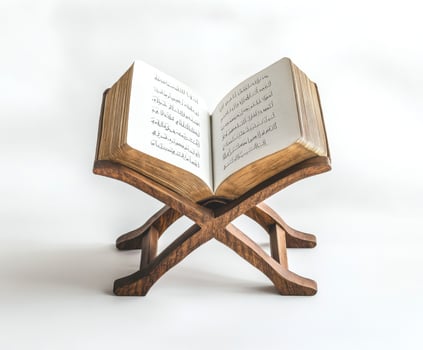 Open Quran on a wooden stand showcasing Arabic calligraphy in a serene setting for study and reflection photo