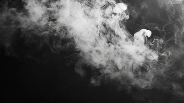 White Smoke Curls and Swirls Against Black Background photo