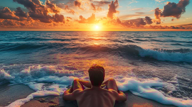 Man Gazing at the Ocean Sunset photo