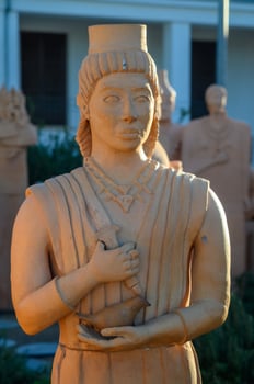 Exploring ancient terracotta sculptures at an archaeological site during golden hour photo
