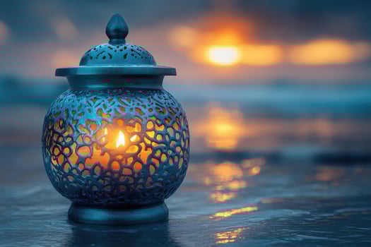 A blue lantern with a candle on the beach photo