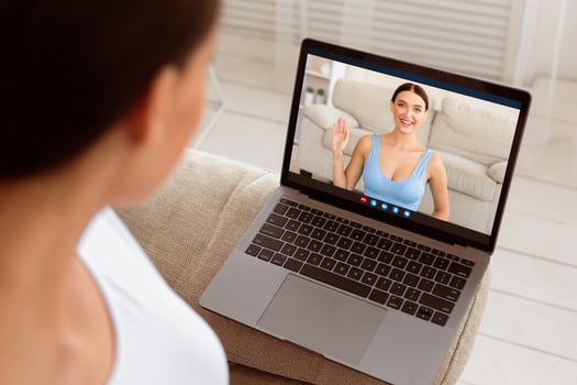 Unrecognizable Lady Watching Online Fitness Training On Laptop Exercising At Home. Workout And Weekend Leisure. Selective Focus, Rear View photo