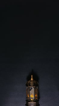 A Lighted Lantern on Black Background photo
