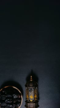 A Plate of Dates With Islamic Lantern photo