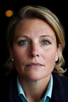 A portrait of a woman with freckles and blue eyes photo