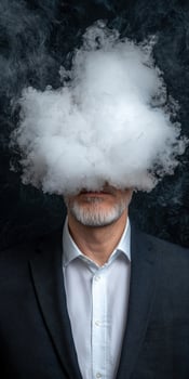 Businessman obscured by a large cloud of vapor, conceptual image of mystery and concealment photo