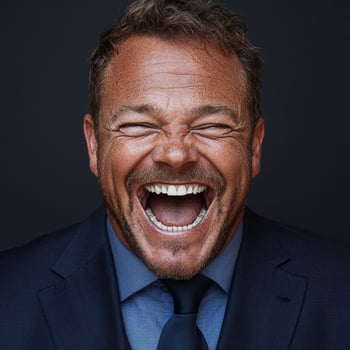 Joyful businessman laughing with open mouth and eyes closed photo