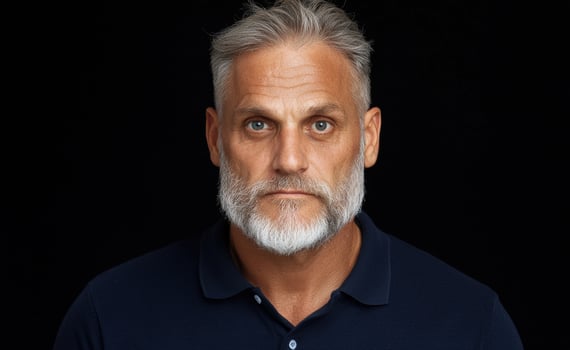 A portrait of a mature man with gray hair and beard photo