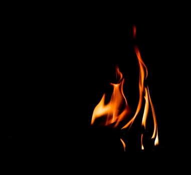 Fire flame isolated on black background. Space for copy photo