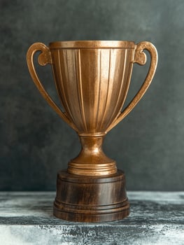 Gold trophy on dark background photo