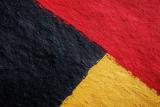 Textured abstract backdrop features bold shades of red, yellow, and black in crayon-like styles with playful patterns, creating a modern, artistic aesthetic perfect for text overlay photo