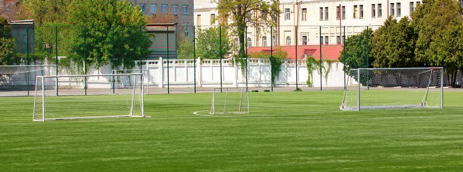 Recreation and sport come together on a vibrant soccer field in midday sunshine. Banner. photo