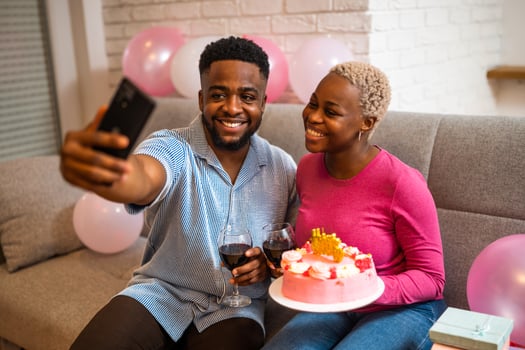 Couple in love taking selfie for birthday photo