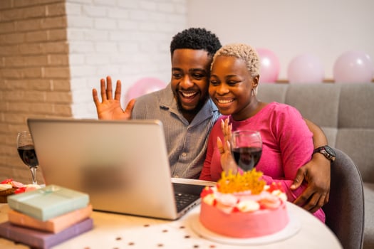 Man and woman talking online with family photo