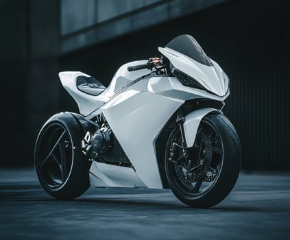 Sleek white motorcycle parked under urban lighting during nighttime photo
