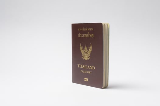 Thai Passport Displayed on a Plain Background photo
