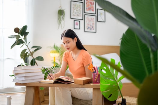University woman doing homework .. photo