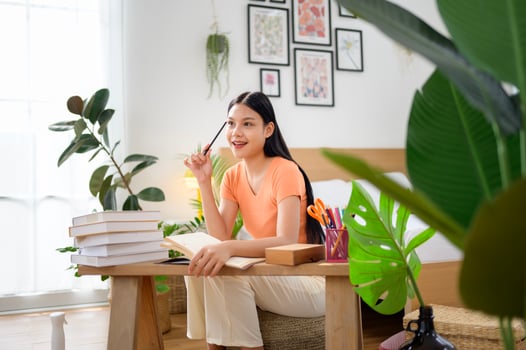 University woman doing homework . photo