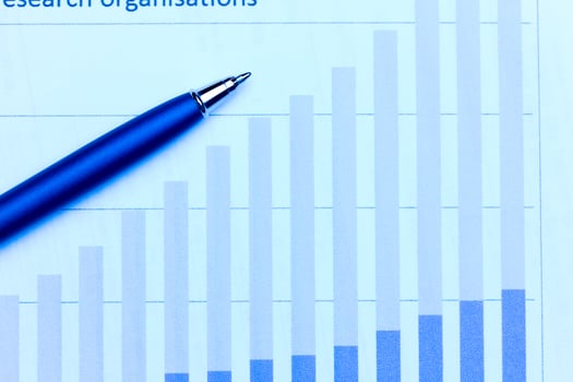 Business charts and pen photo