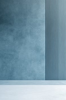 A tranquil abstract background showcases a lightly textured wall in muted blue complemented by subtle linear patterns. The serene design features ample negative space perfect for text overlay photo