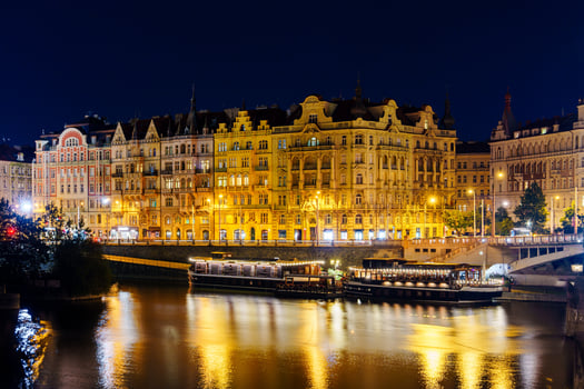 Stunning view of Vltava River in Prague, Czech Republic at night with historic landmarks photo