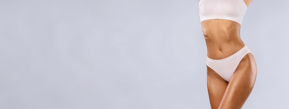 Love Yourself, Body Neutrality. Positive Slim Lady With Perfect Ideal Shape And Appearance Posing Isolated On Blue Studio Background, Lady In White Underwear Enjoying Herself, Free Copy Space, Banner photo