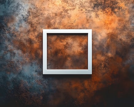 White Frame Against a Textured Brown and Blue Wall photo