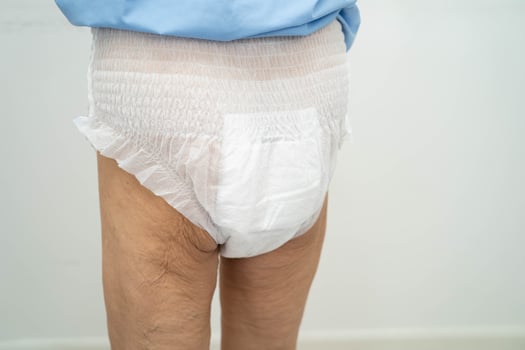 Asian senior woman patient wearing adult incontinence diaper pad photo