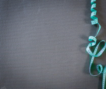 board with a tailor measuring tape photo