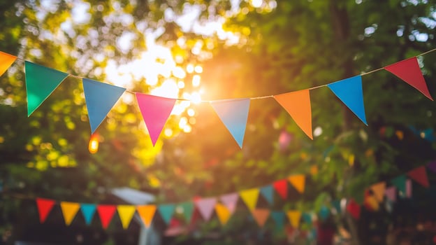 Colorful Party Flags Bunting in Bright Sunlight Against a Natural Background photo