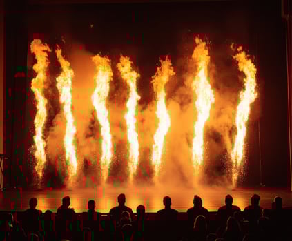 Dramatic fire display captivates audience during live performance at city theater photo