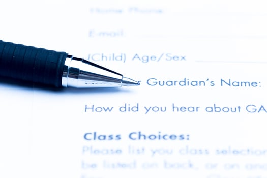 Close-up of pen on contract photo