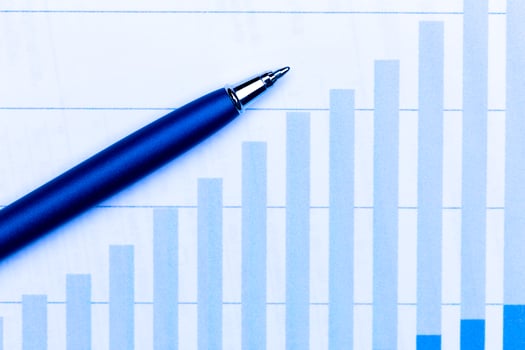 Business charts and pen photo